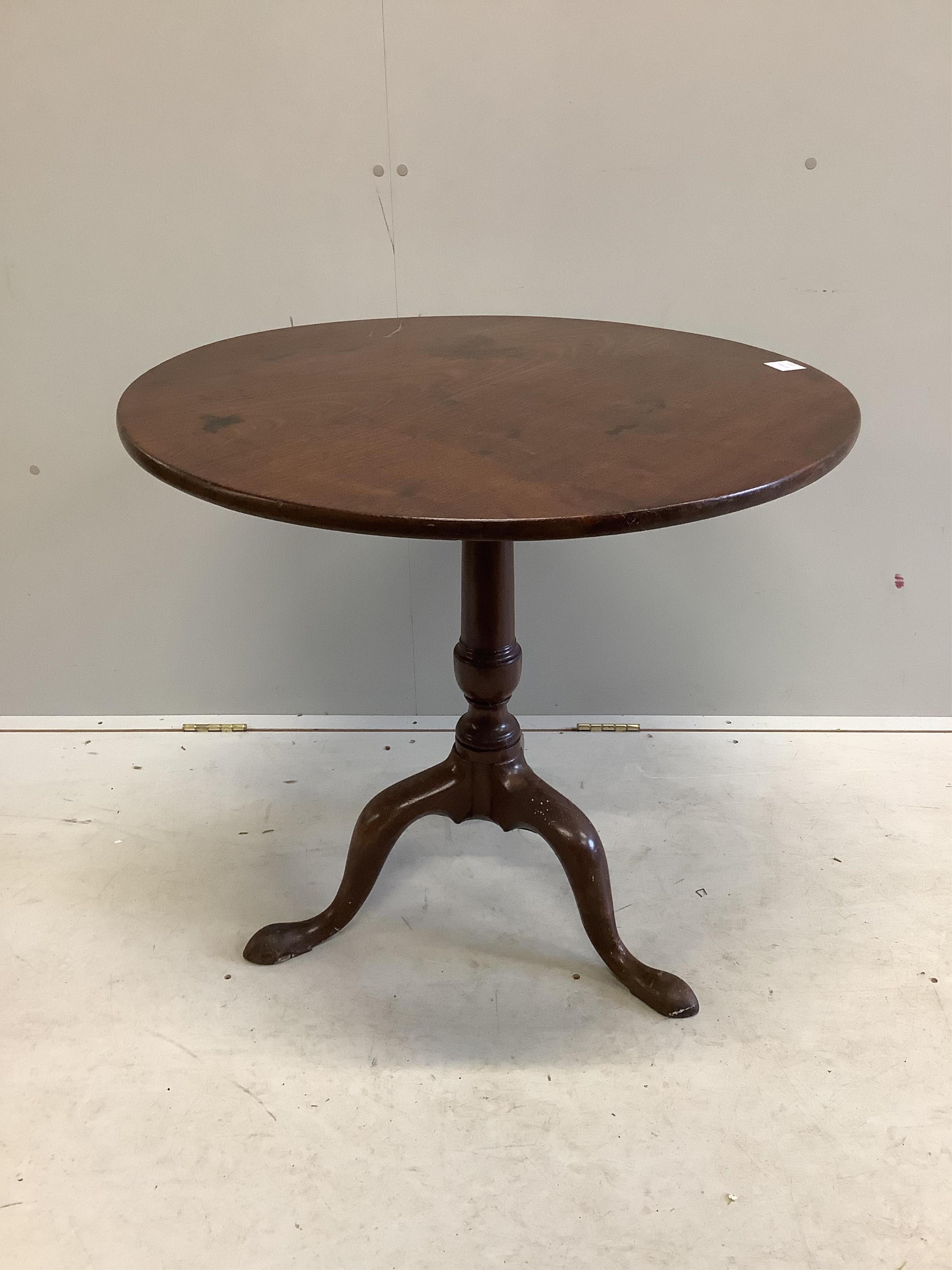 A George III circular mahogany tilt top tea table, diameter 78cm, height 71cm. Condition - fair